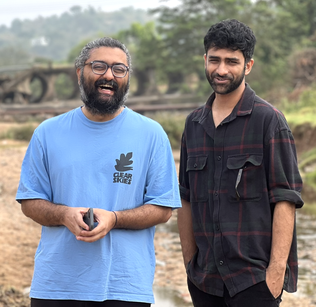 Two ArtWorksIT team members sharing a candid moment outdoors